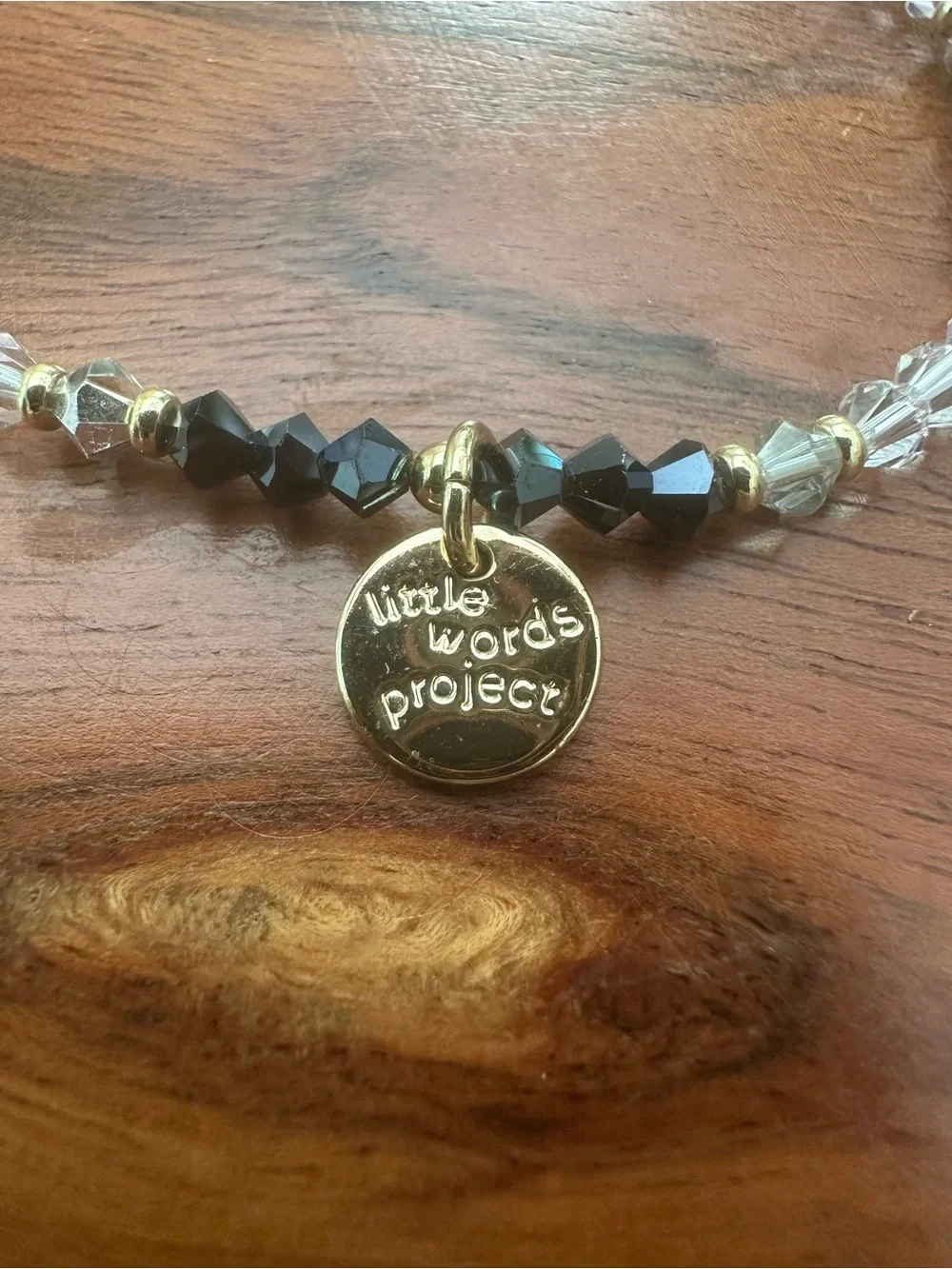 White and Black Beaded‎ Bracelet with Gold Charm
